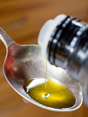 Oil in a spoon used for oil pulling