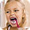 little girl brushing her teeth vigorously